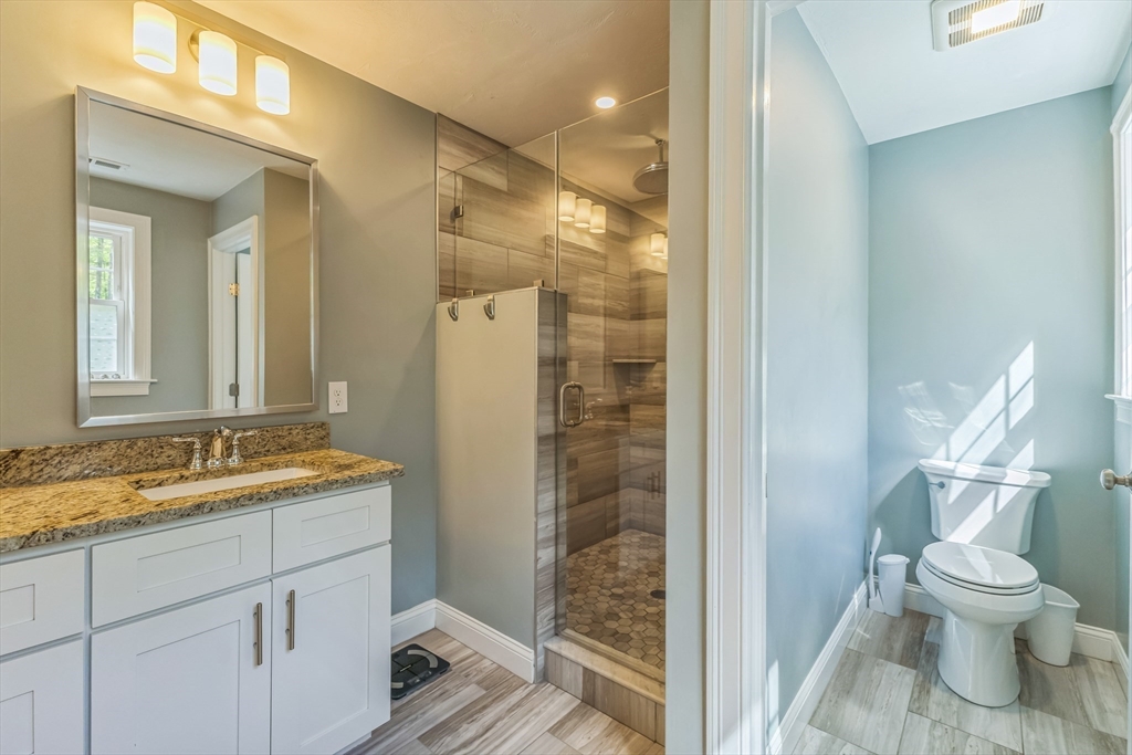 82 Sutton Street Uxbridge, MA 01569 - Photo 26 of 31 a bathroom with a granite countertop sink toilet and shower