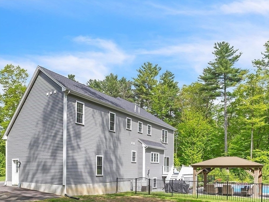 82 Sutton Street Uxbridge, MA 01569 - Photo 27 of 31 a front view of a house with a yard
