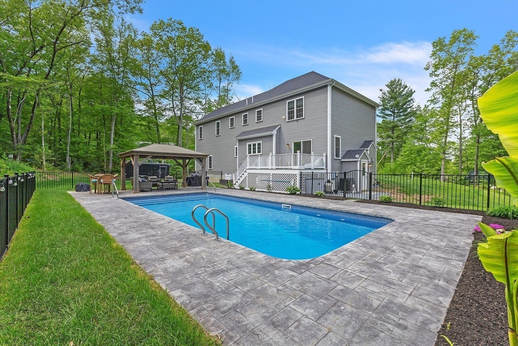 82 Sutton Street Uxbridge, MA 01569 - Photo 29 of 31 a view of a house with swimming pool and sitting area