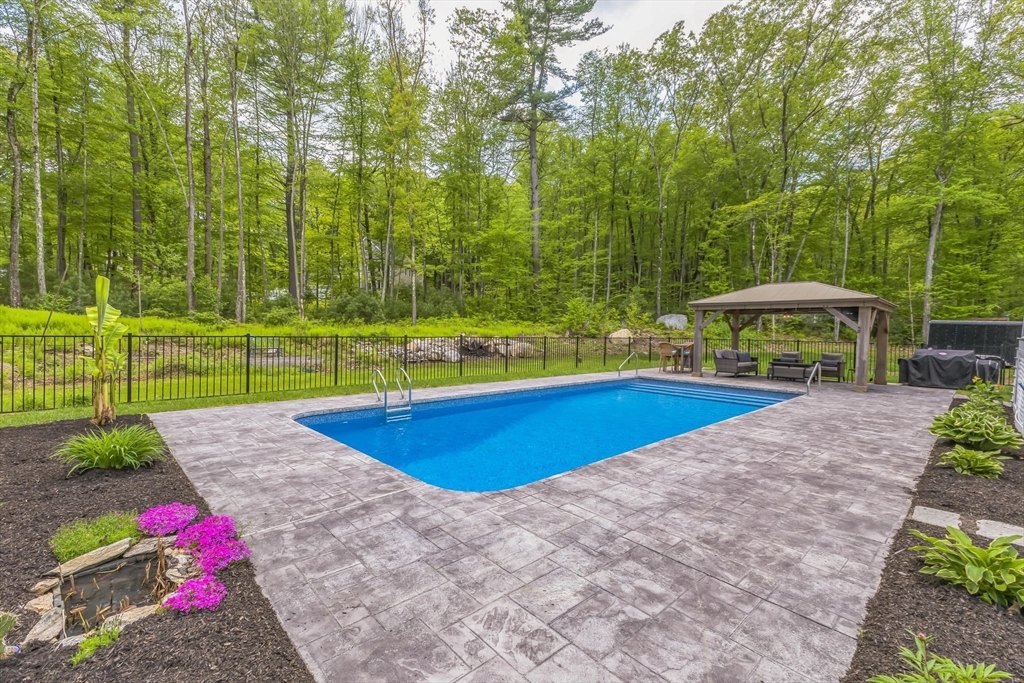 82 Sutton Street Uxbridge, MA 01569 - Photo 31 of 31 a view of a backyard with swimming pool