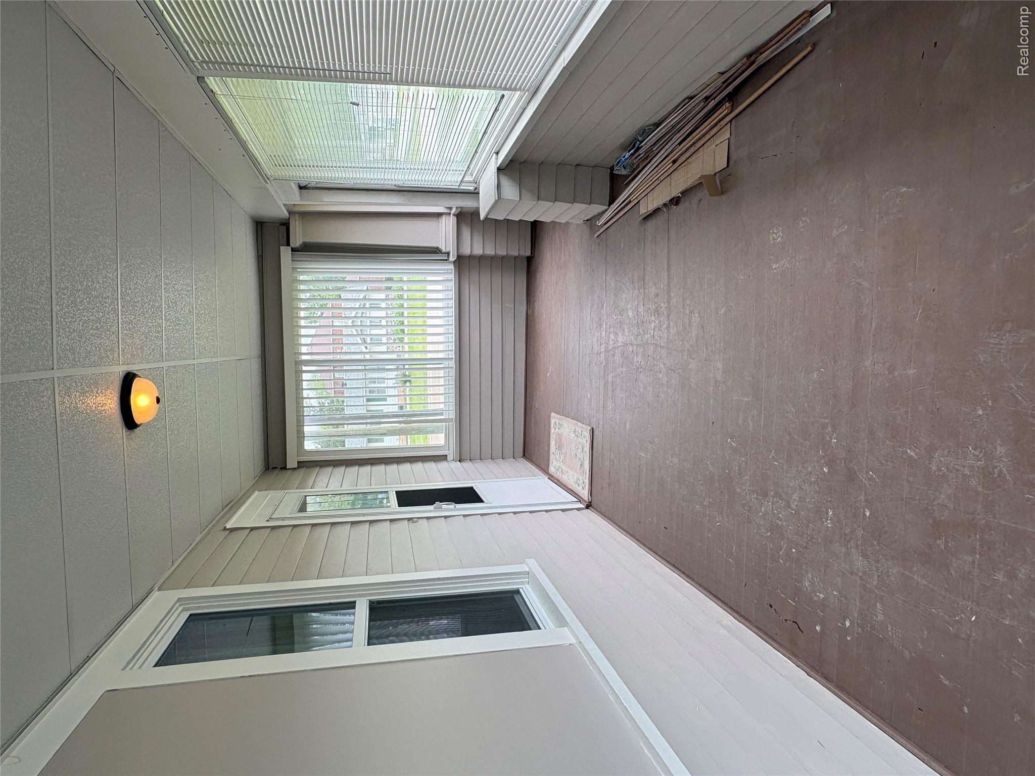 2175 West Auburn Road Rochester, MI 48309 - Photo 10 of 30 Unfurnished sunroom with wooden walls