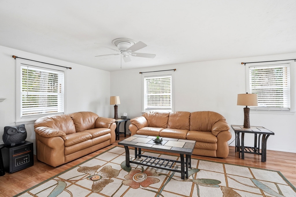 94 Edgewater Drive Wareham, MA 02571 - Photo 13 of 37 a living room with furniture ceiling fan and a window