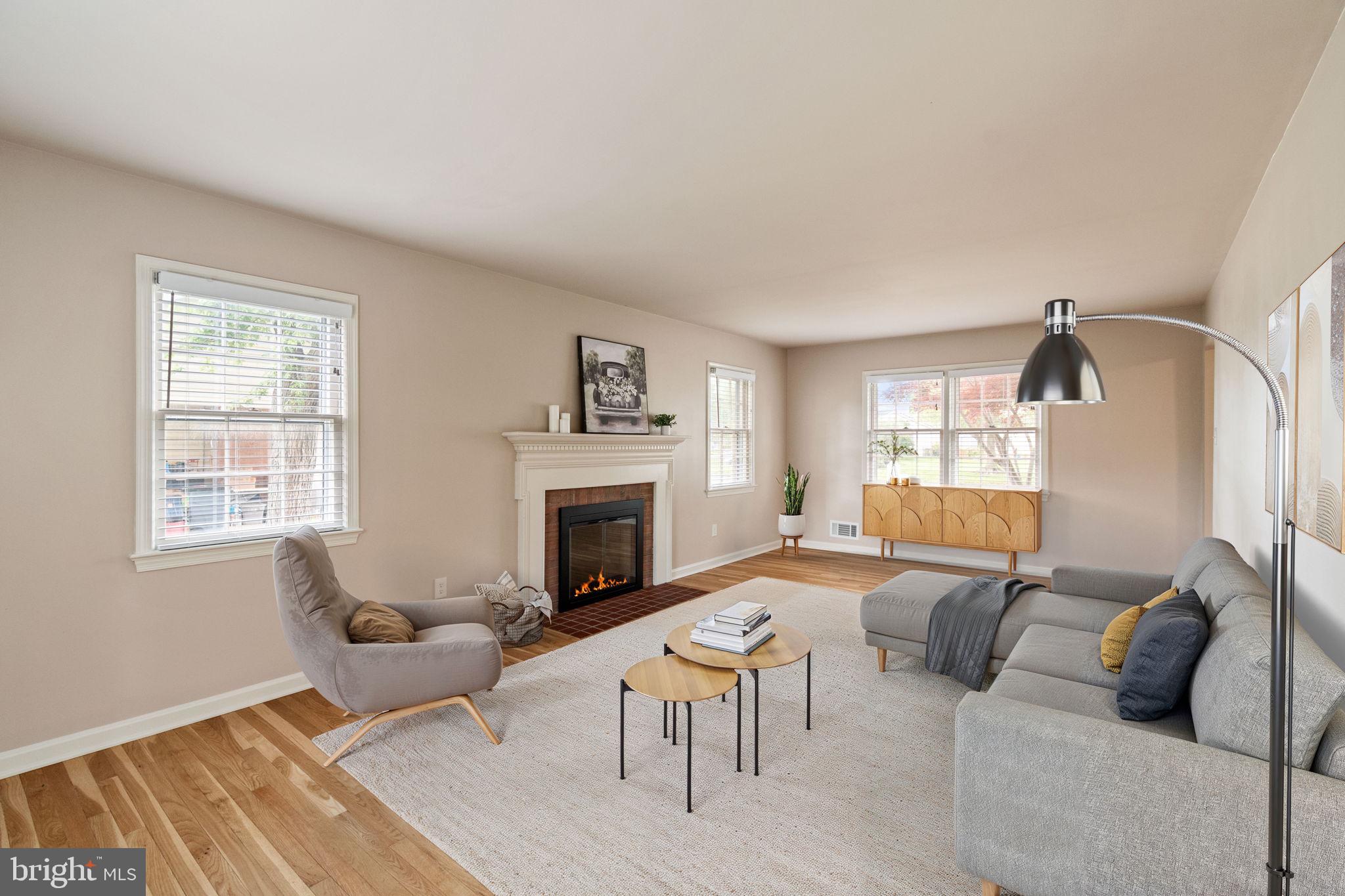 Spacious &  elegant LR with FP & wood floors