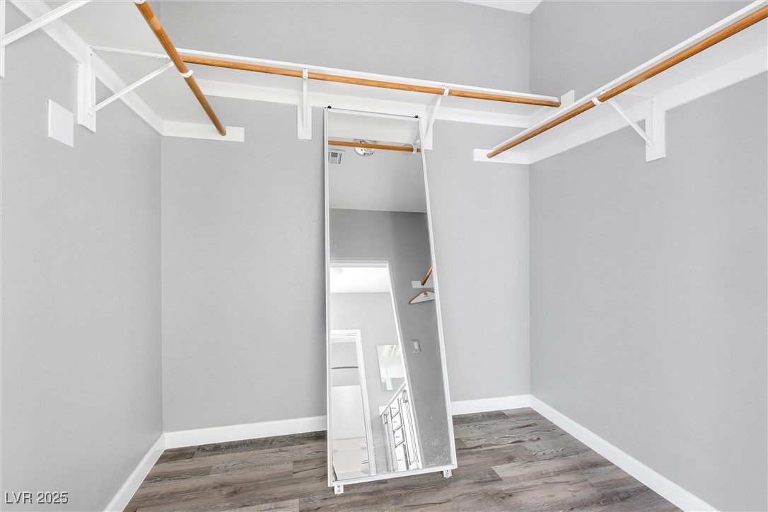 9617 Sharp Horn Court Las Vegas, NV 89149 - Photo 18 of 27 Spacious closet with visible vents and wood finished floors