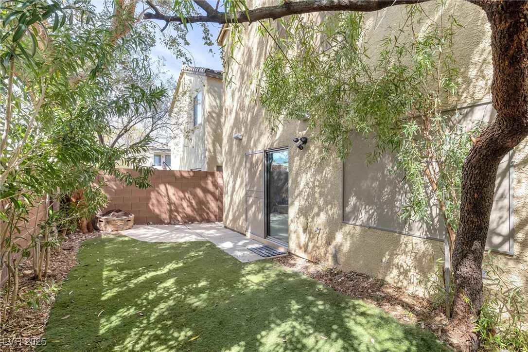 9617 Sharp Horn Court Las Vegas, NV 89149 - Photo 25 of 27 View of yard featuring a fenced backyard and a patio area