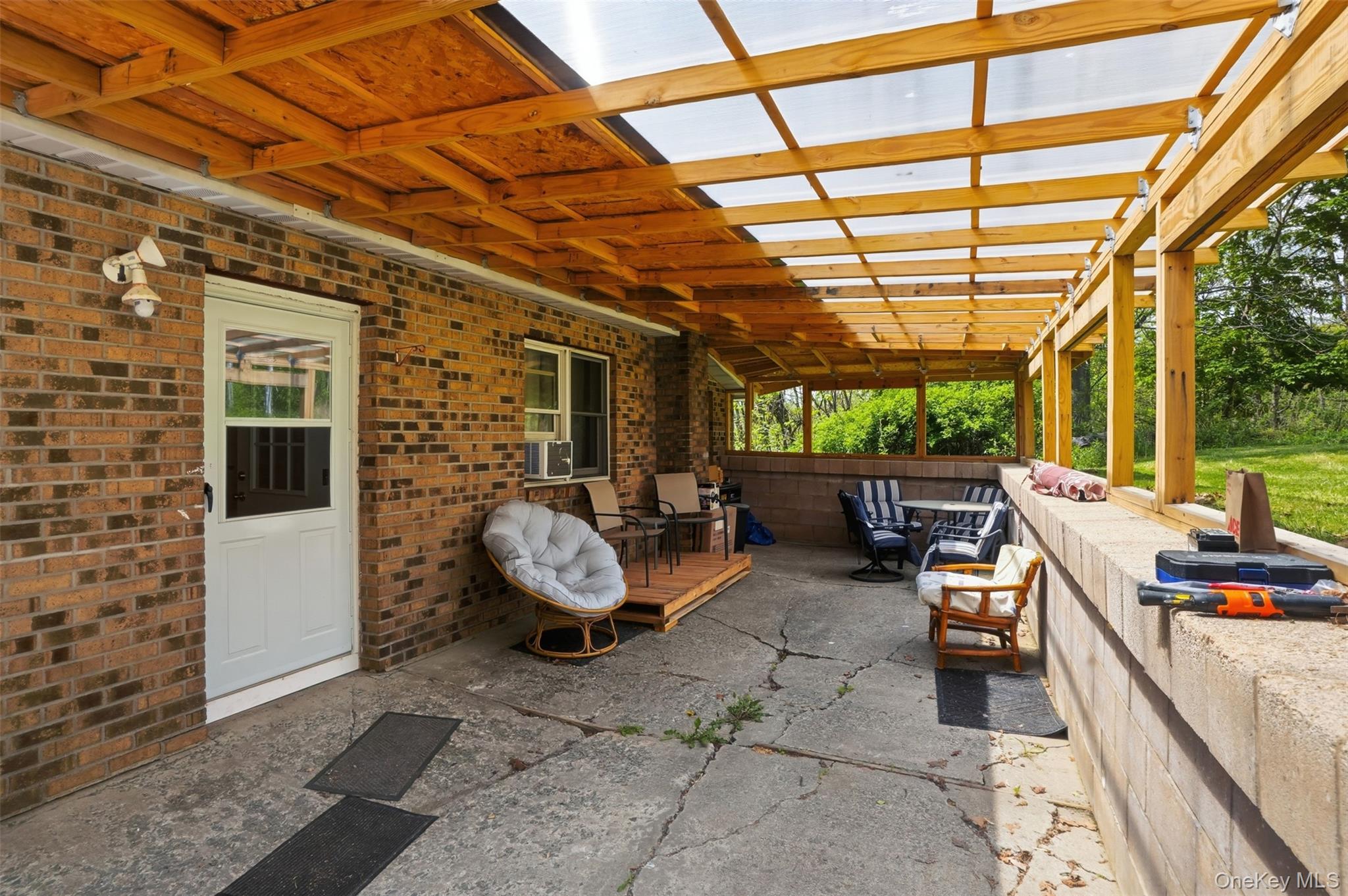6 Short Road Wurtsboro, NY 12790 - Photo 14 of 48 a view of living room with patio furniture and a grill