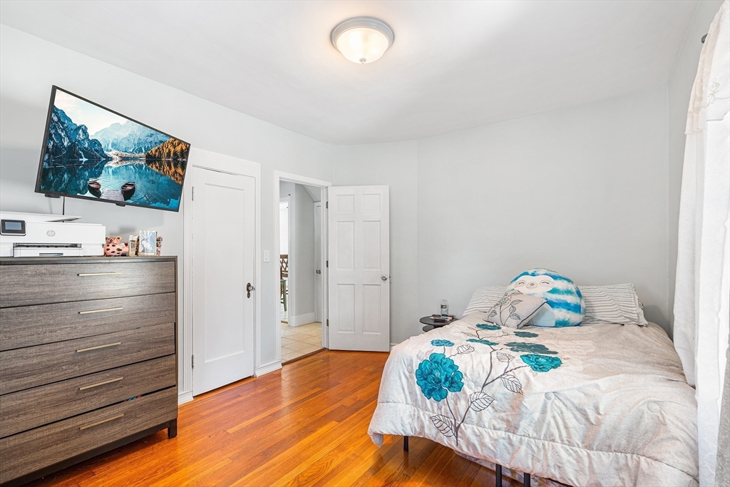 3 Fitz Road Peabody, MA 01960 - Photo 14 of 34 a bedroom with a bed and wooden floor