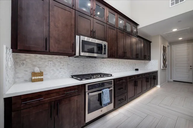 a utility room with sink dryer and washer