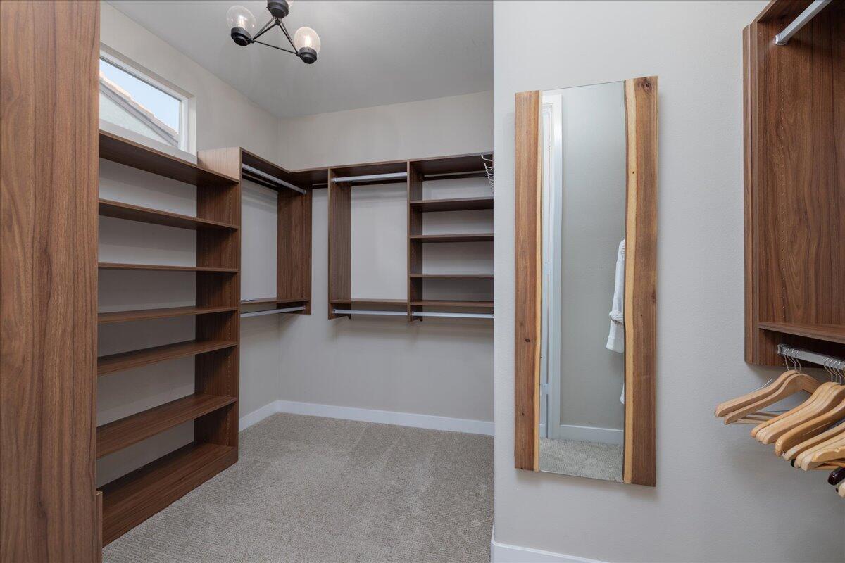 1514 Overpark Lane Beaumont, CA 92223 - Photo 23 of 76 a view of walk in closet with empty racks