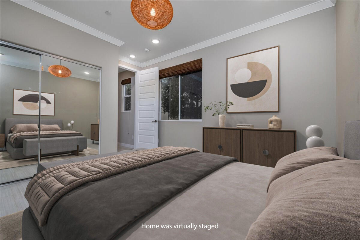 1514 Overpark Lane Beaumont, CA 92223 - Photo 24 of 76 a bedroom with a large bed and a large mirror