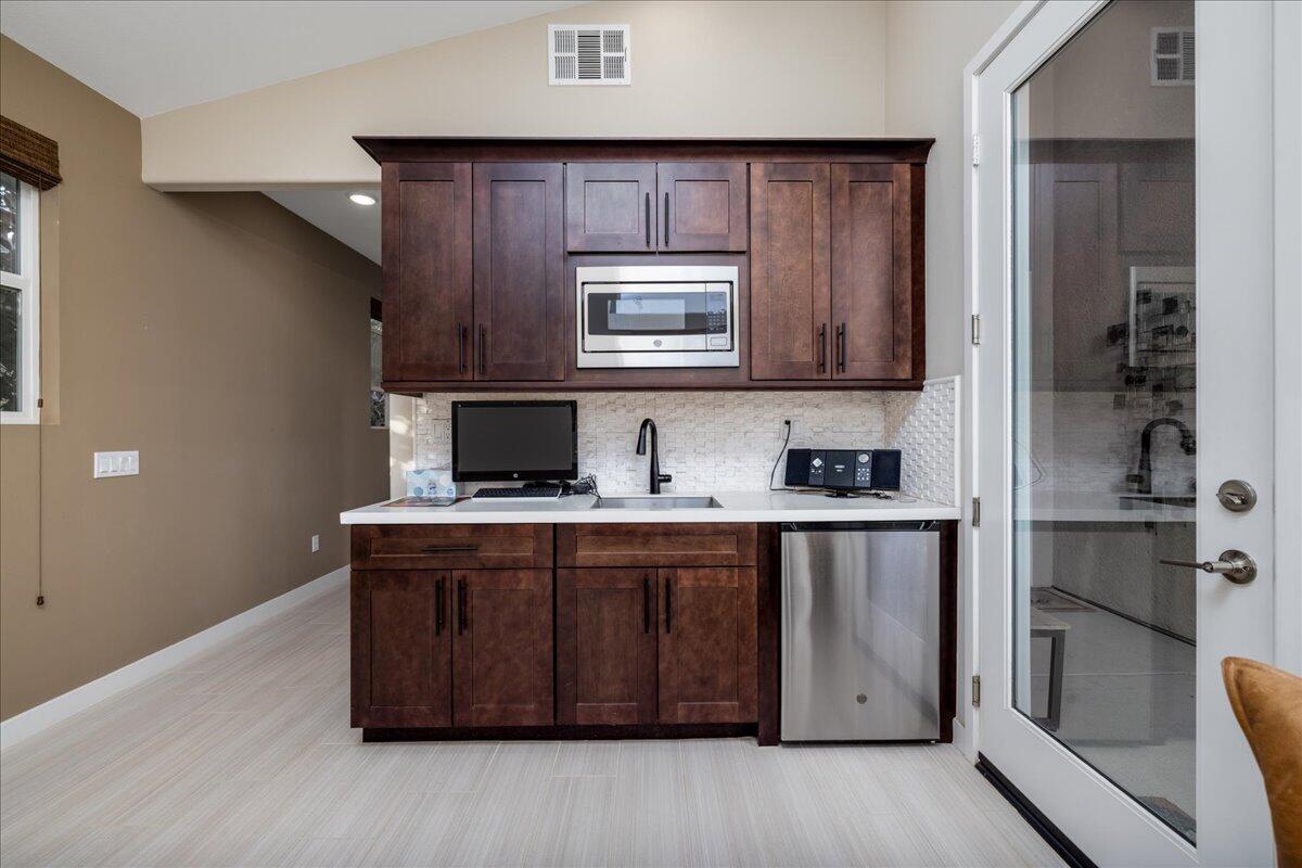 1514 Overpark Lane Beaumont, CA 92223 - Photo 26 of 76 a kitchen with a stove and a sink