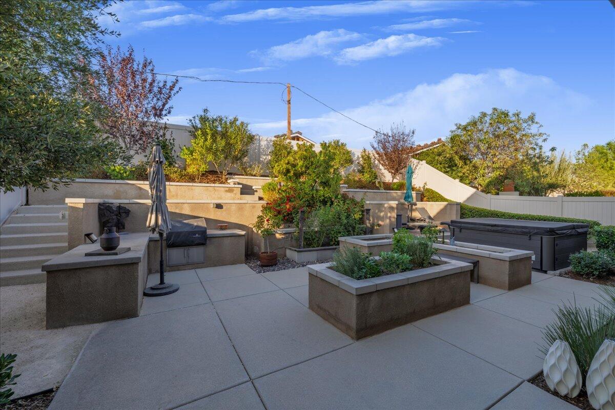 1514 Overpark Lane Beaumont, CA 92223 - Photo 29 of 76 a view of a patio with couches and potted plants