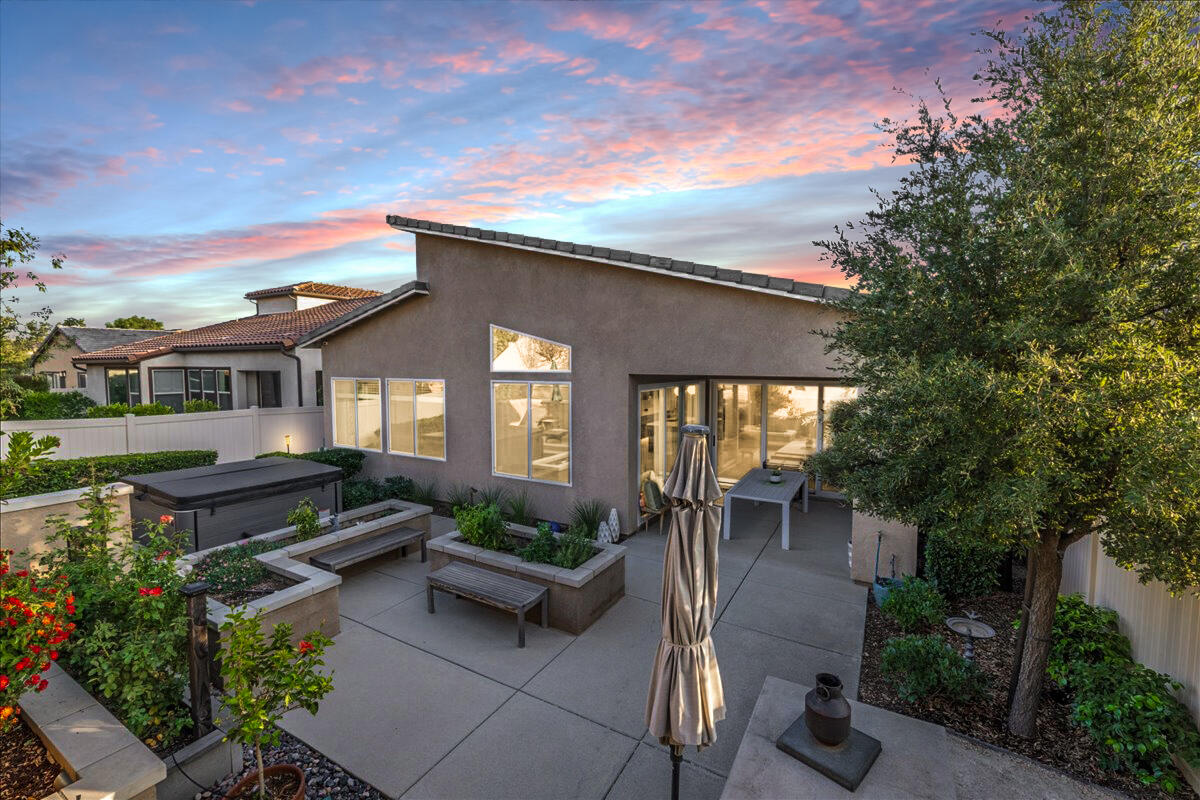 1514 Overpark Lane Beaumont, CA 92223 - Photo 34 of 76 a view of a patio with couches table and chairs and potted plants