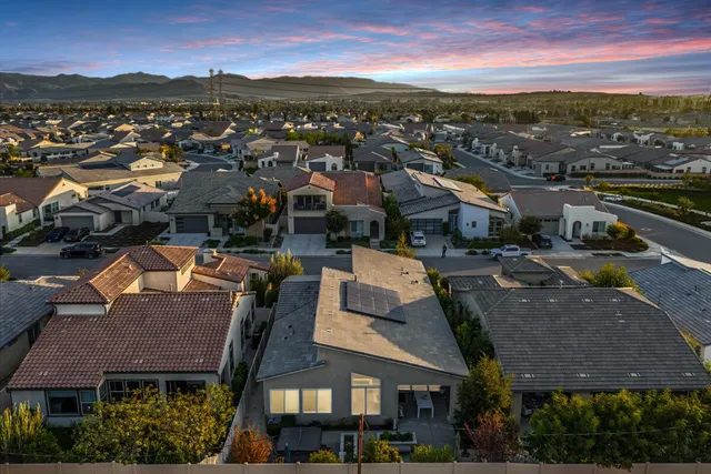 an aerial view of a house a yard and lake view