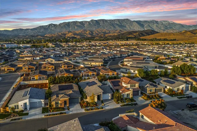 an aerial view of residential houses and outdoor space