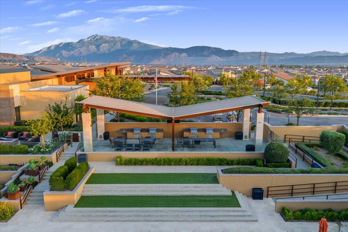 1514 Overpark Lane Beaumont, CA 92223 - Photo 62 of 76 a front view of a house with a yard and potted plants