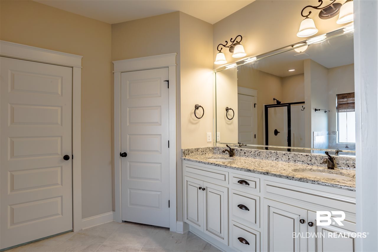 8686 Rosedown Lane Daphne, AL 36526 - Photo 16 of 29 Master bath has double sinks and lots of storage.