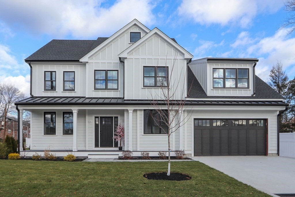 138 Lexington Street Newton, MA 02466 - Photo 1 of 27 a front view of a house with a yard