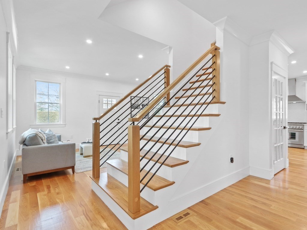 138 Lexington Street Newton, MA 02466 - Photo 12 of 27 a view of entryway livingroom and hall with wooden floor
