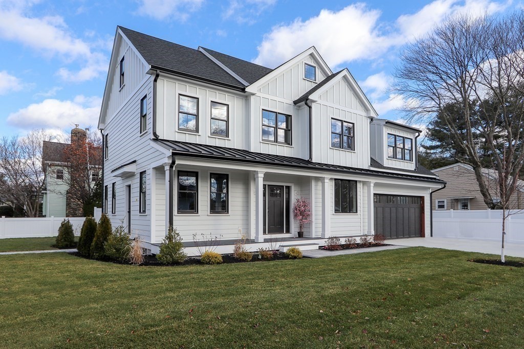 138 Lexington Street Newton, MA 02466 - Photo 25 of 27 a front view of a house with a yard