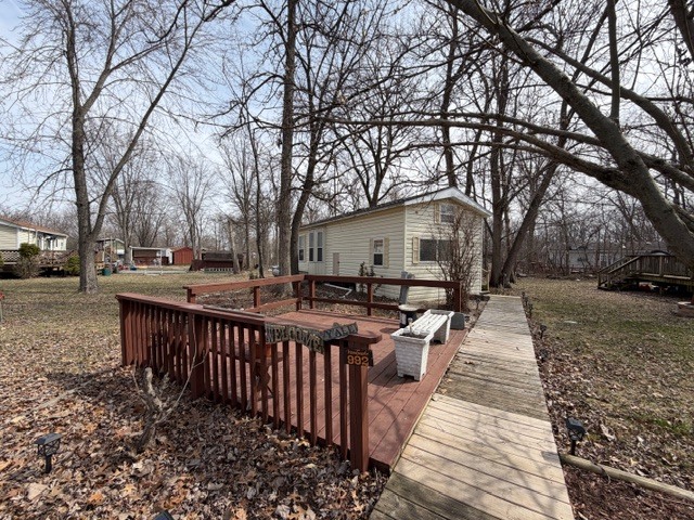2795 East 28th Road Marseilles, IL 61341 - Photo 5 of 69 a view of a wooden deck and trees with wooden fence