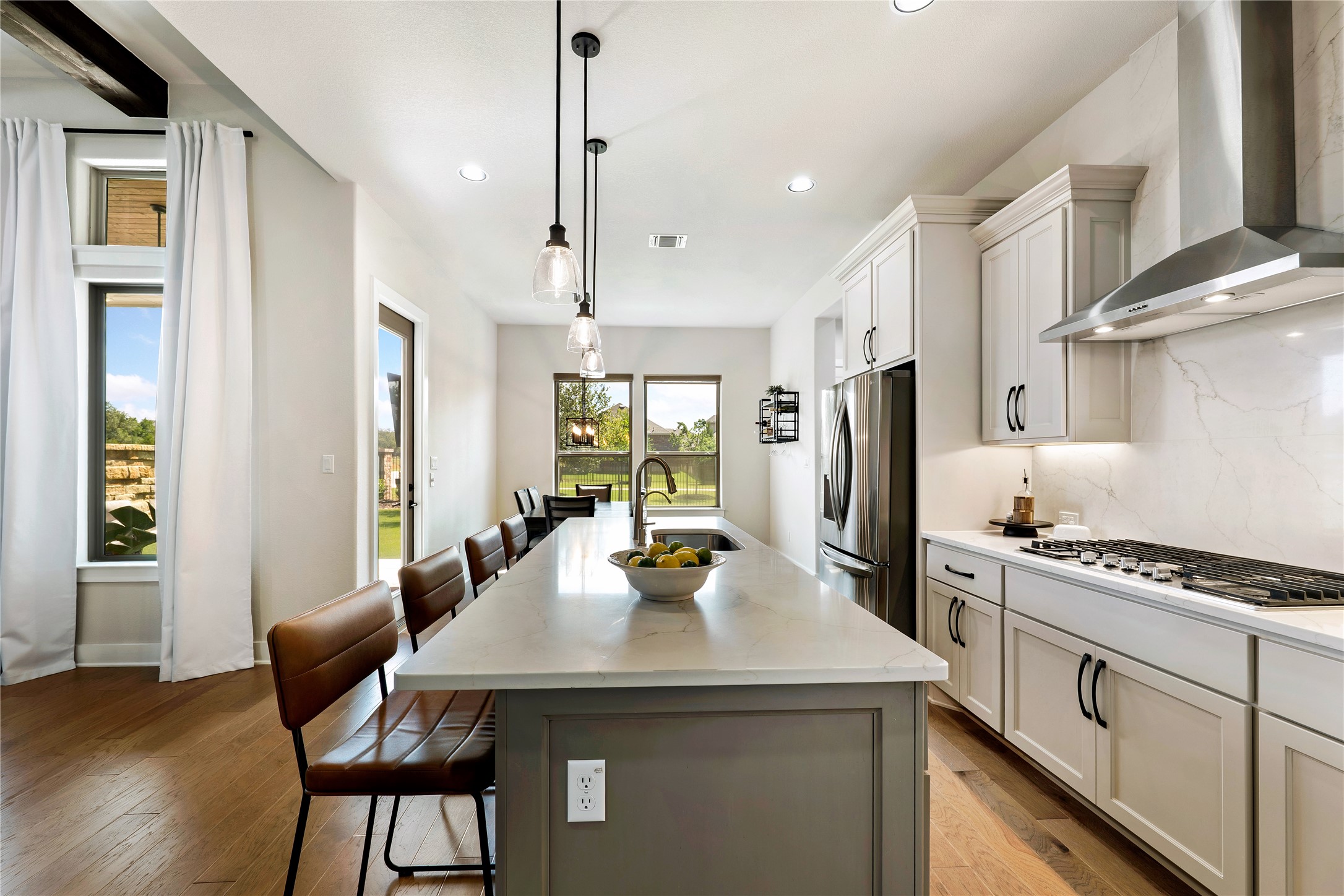 2408 Nate's Place Georgetown, TX 78633 - Photo 13 of 40 Culinary creations come alive in this meticulously appointed kitchen featuring an expansive central island and premium appliances.