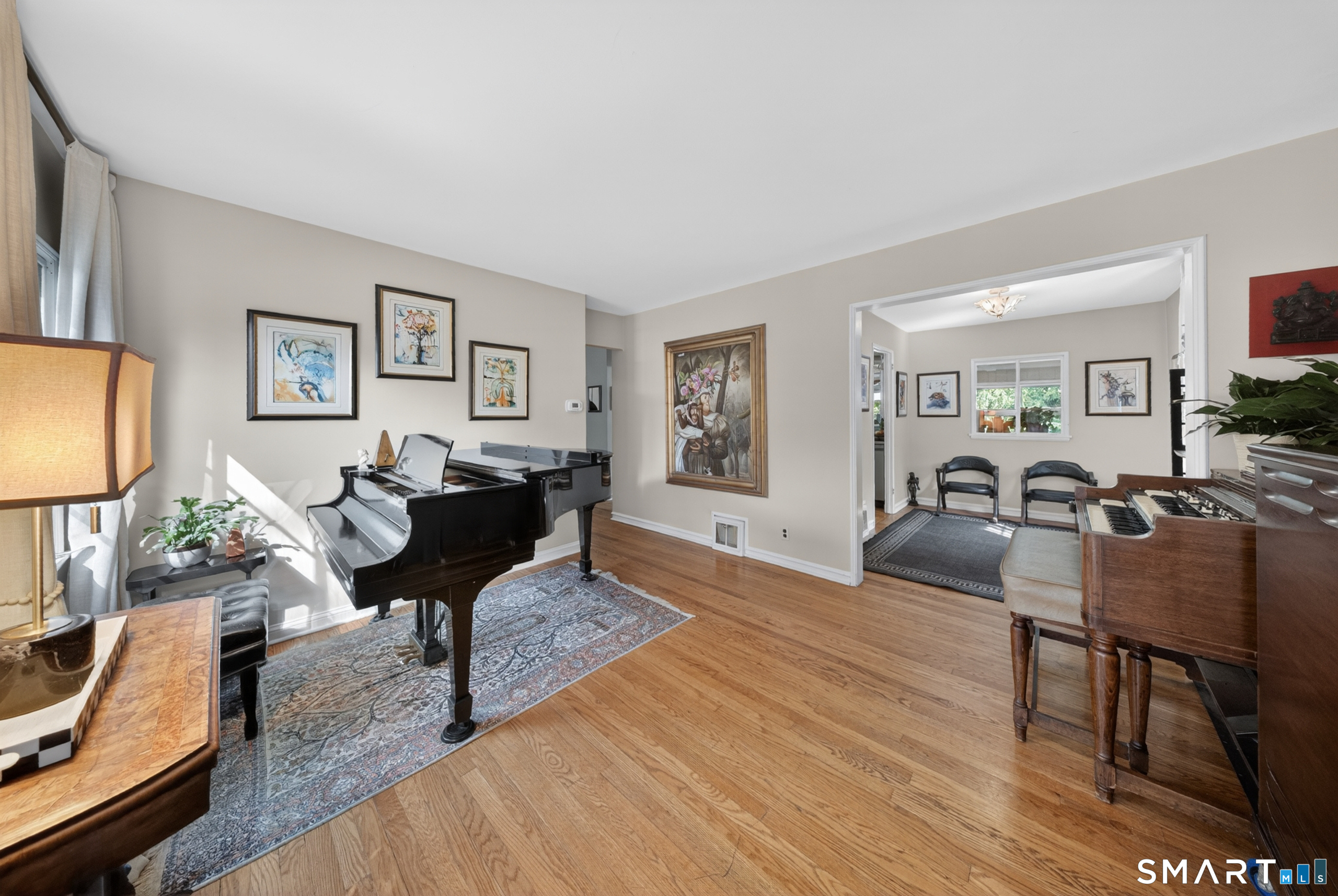68 Old Elm Road Fairfield, CT 06825 - Photo 5 of 40 a living room with furniture a piano and a flat screen tv