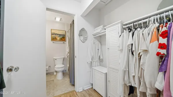 a bathroom with a shower and a toilet