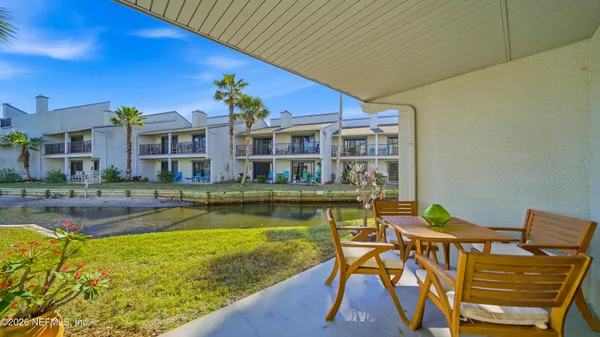 a view of swimming pool with outdoor seating