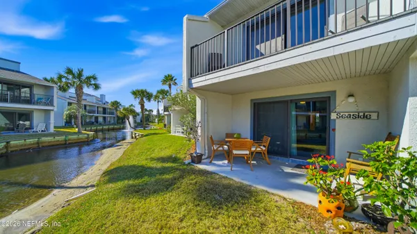 a view of an house with swimming pool porch and furniture