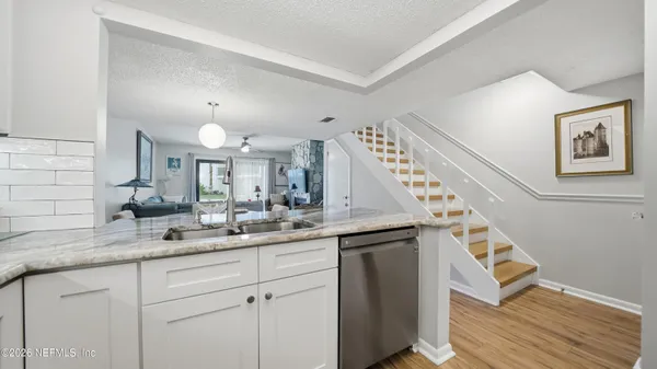a kitchen with a sink and cabinets