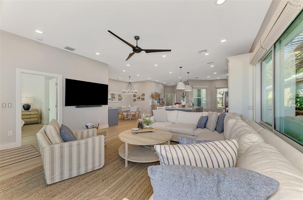 561 Fallbrook Drive Venice, FL 34292 - Photo 27 of 81 a living room with furniture and a flat screen tv