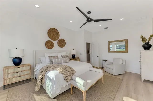 a dining room with furniture and a floor to ceiling window