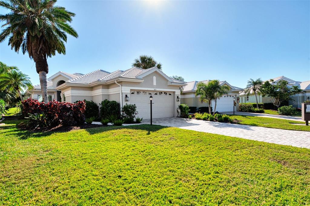 561 Fallbrook Drive Venice, FL 34292 - Photo 3 of 81 a view of a house with a swimming pool and a yard