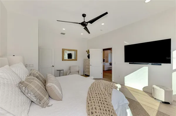 a view of swimming pool with outdoor seating and plants