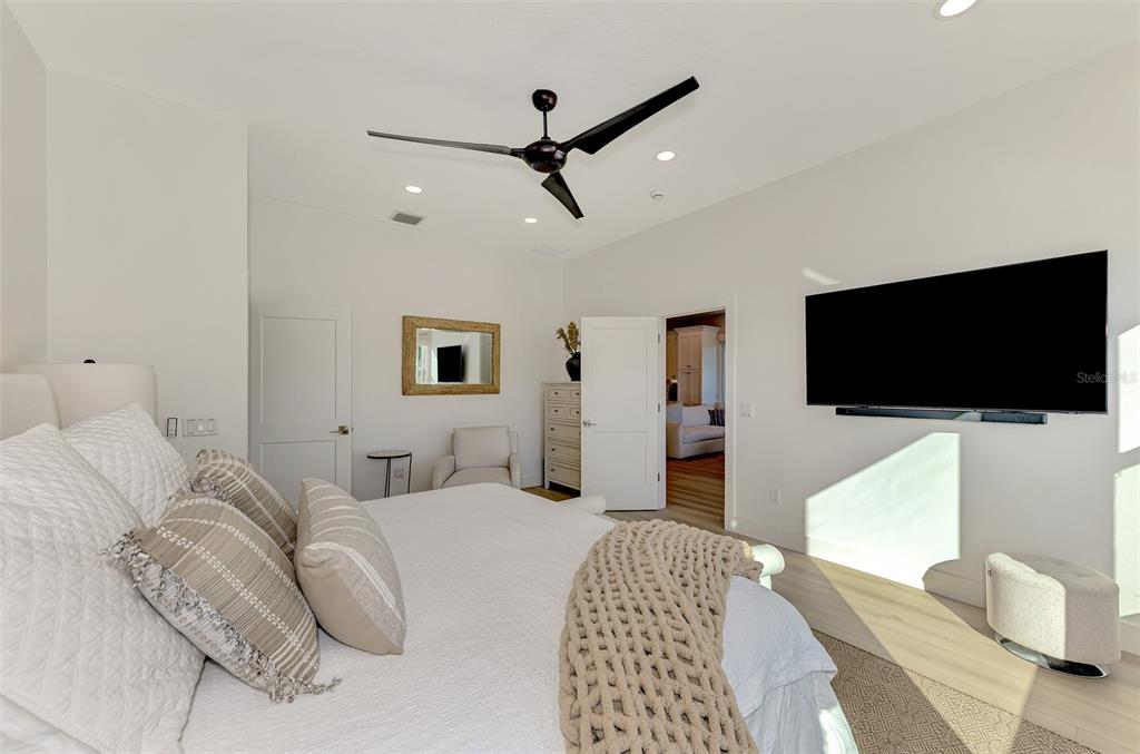 561 Fallbrook Drive Venice, FL 34292 - Photo 31 of 81 a bedroom with a bed and a flat screen tv