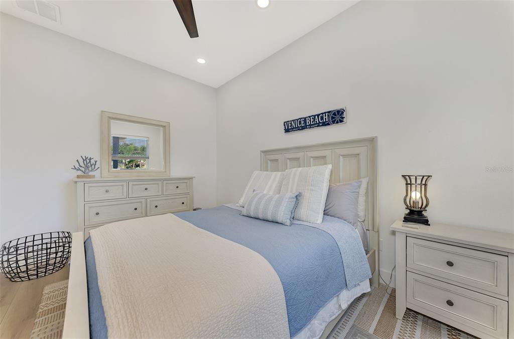561 Fallbrook Drive Venice, FL 34292 - Photo 35 of 81 a bedroom with a bed and a night stand