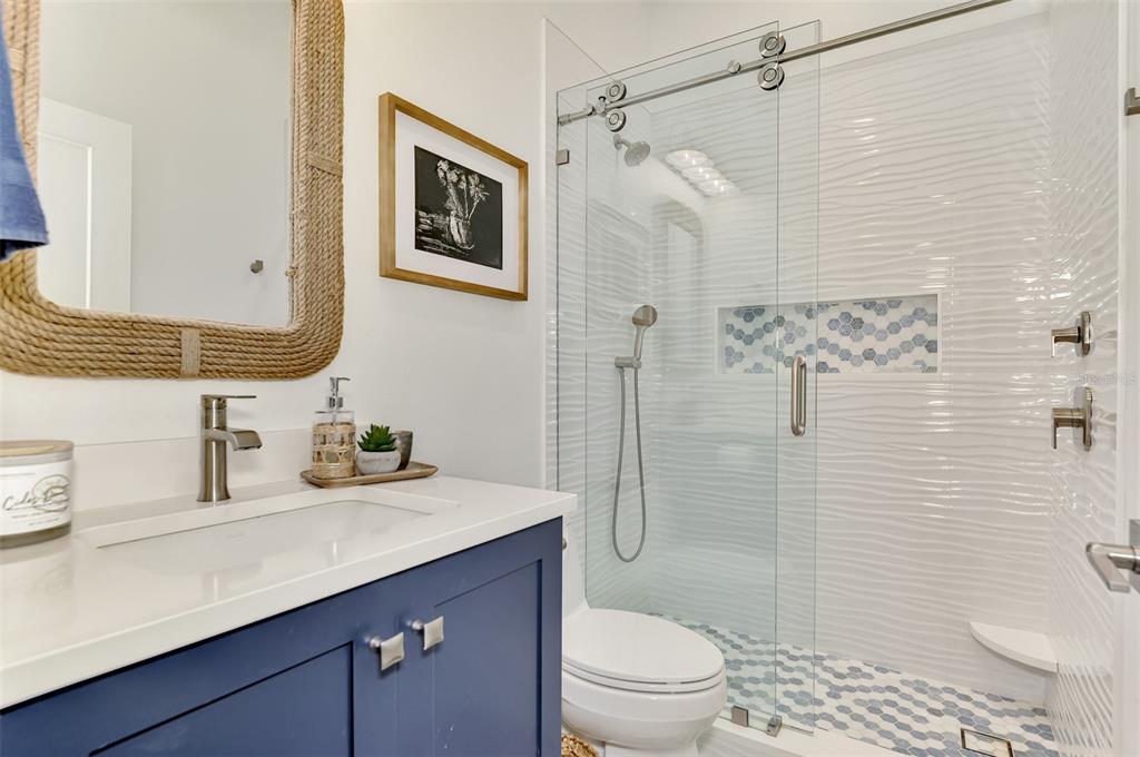 561 Fallbrook Drive Venice, FL 34292 - Photo 37 of 81 a bathroom with a sink toilet vanity and shower