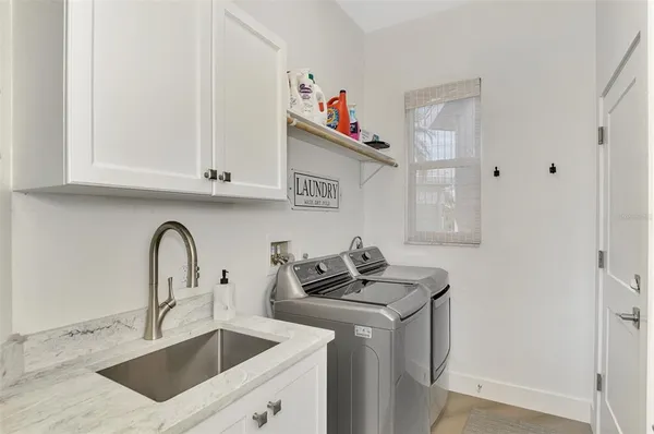 an aerial view of a house with outdoor space