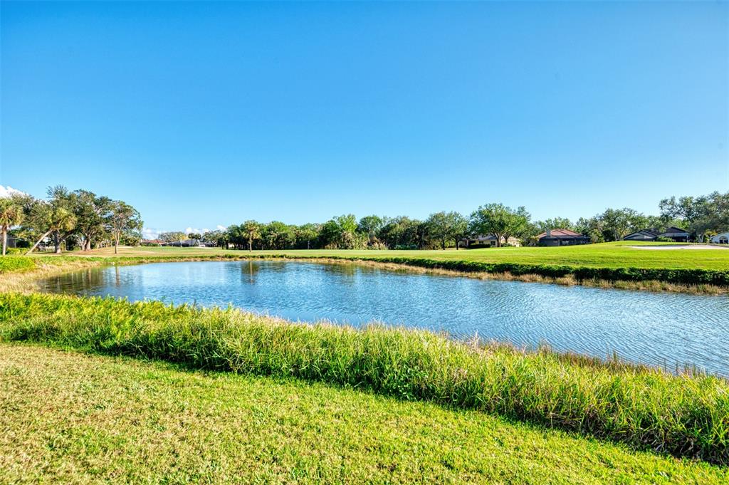 561 Fallbrook Drive Venice, FL 34292 - Photo 47 of 81 a view of a lake with houses in the back