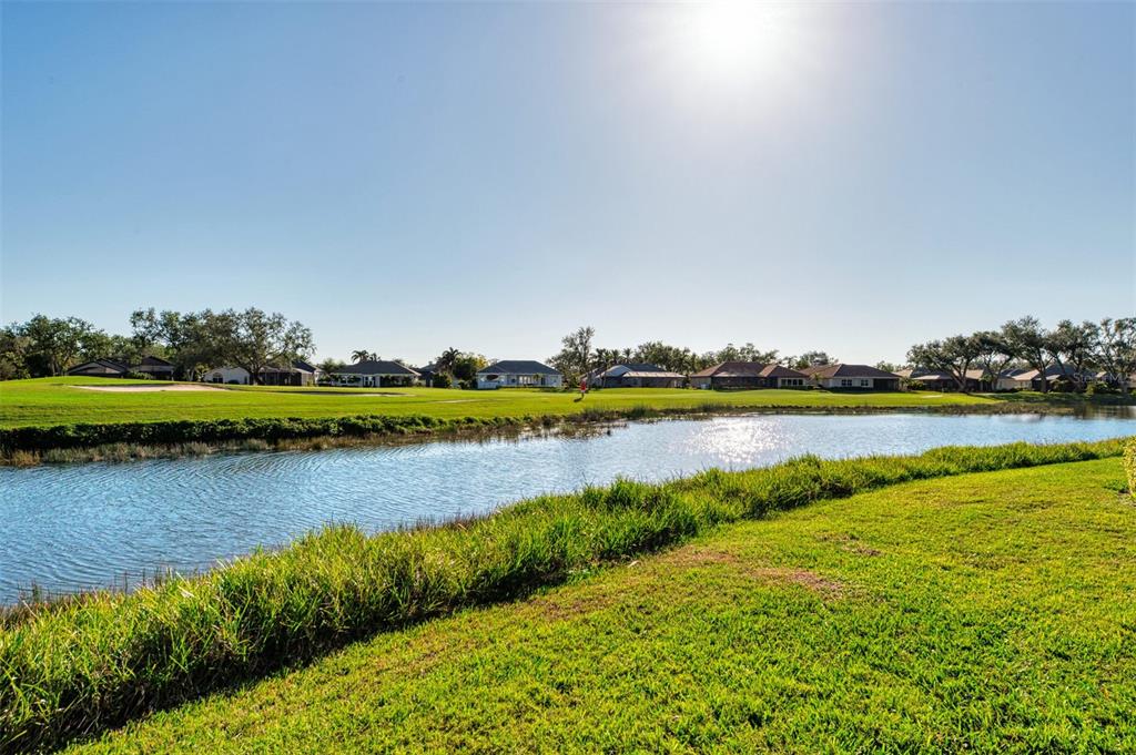 561 Fallbrook Drive Venice, FL 34292 - Photo 48 of 81 a view of a lake with houses in the back