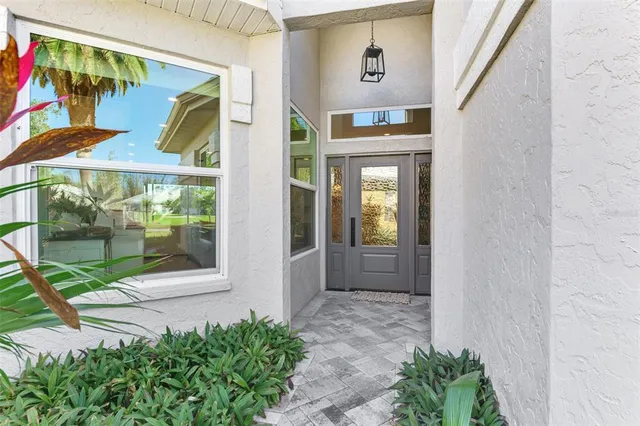 a large kitchen with stainless steel appliances granite countertop a stove a refrigerator a oven a sink with a dining table and chairs