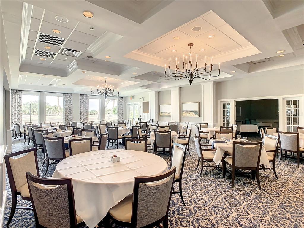 561 Fallbrook Drive Venice, FL 34292 - Photo 77 of 81 a dining room with a table or chairs and a dining table with wooden floor