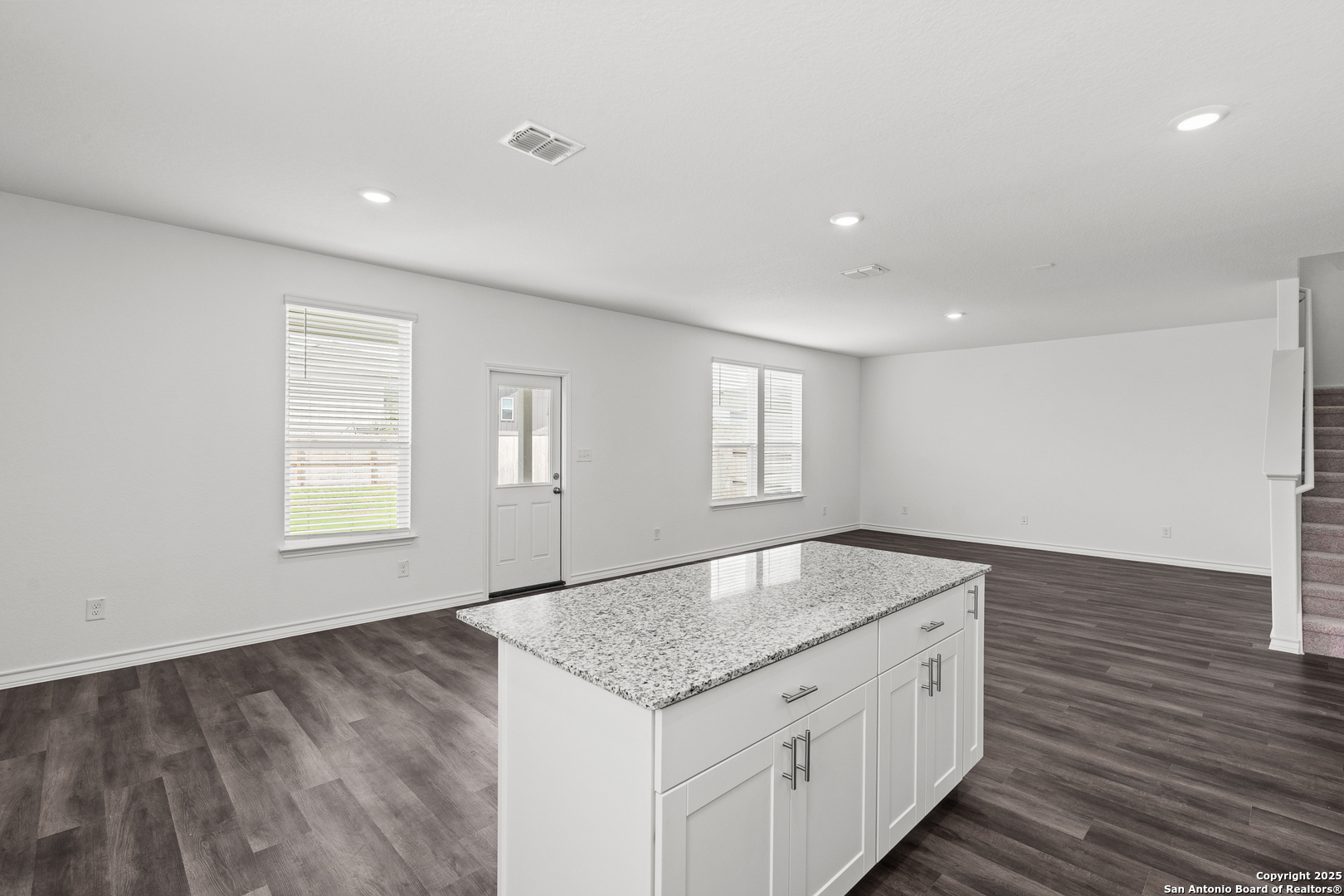 4068 Paddock Trail Seguin, TX 78155 - Photo 14 of 34 a kitchen with granite countertop sink and cabinets