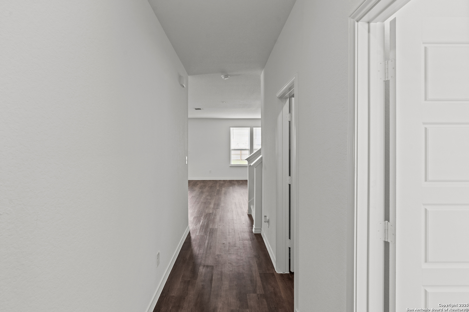 4068 Paddock Trail Seguin, TX 78155 - Photo 3 of 34 a view of a hallway with wooden floor