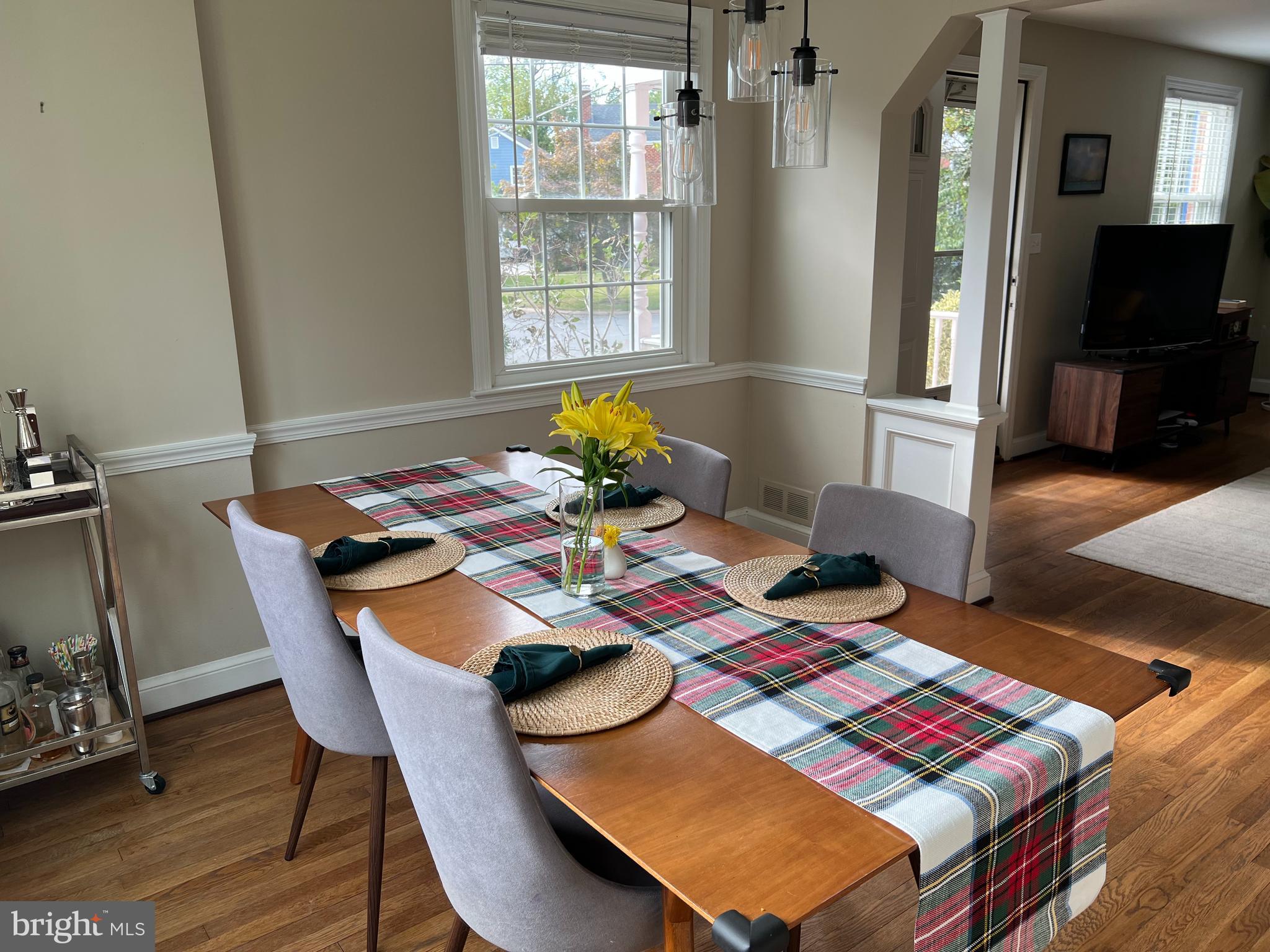 405 Gilmoure Drive Silver Spring, MD 20901 - Photo 14 of 53 a view of a dining room with furniture and a window