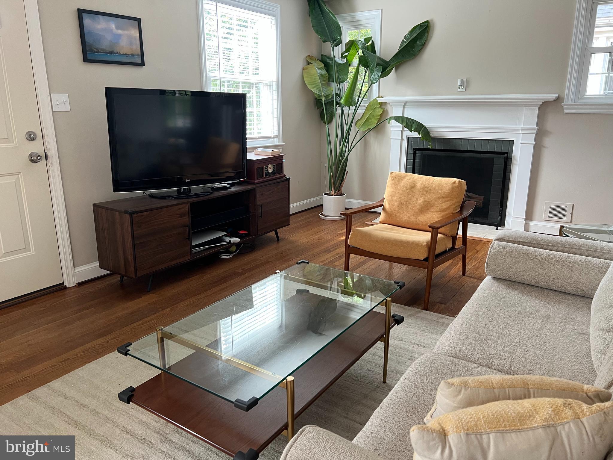 405 Gilmoure Drive Silver Spring, MD 20901 - Photo 15 of 53 a living room with furniture and a flat screen tv