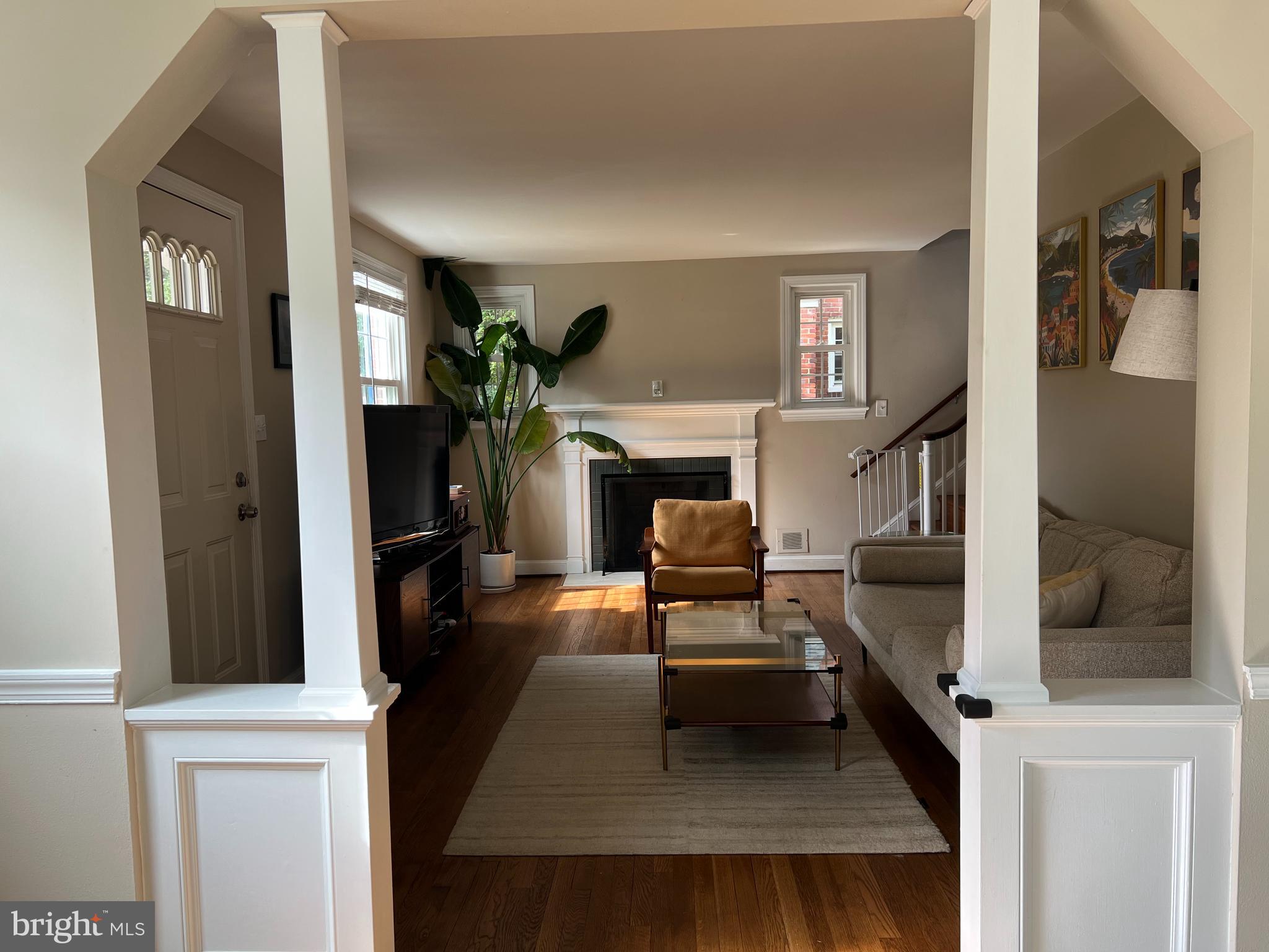 405 Gilmoure Drive Silver Spring, MD 20901 - Photo 16 of 53 a living room with furniture and a fireplace