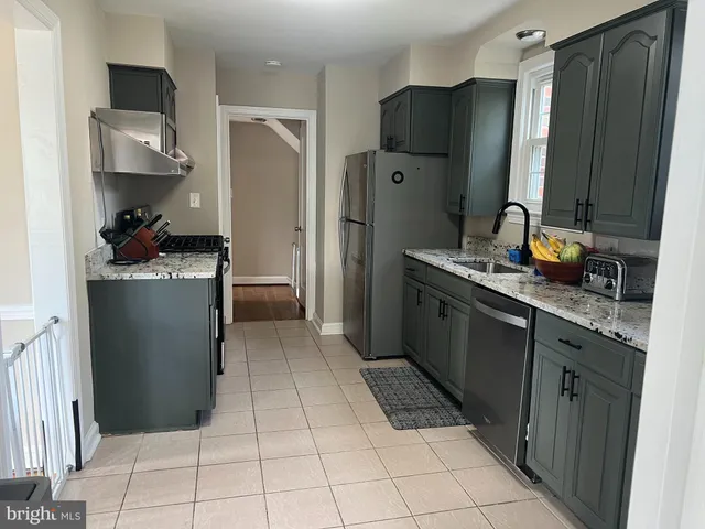 a kitchen with a sink and a window