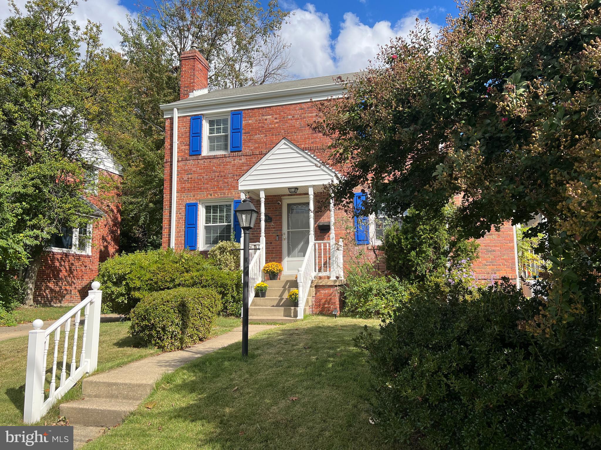 405 Gilmoure Drive Silver Spring, MD 20901 - Photo 2 of 53 a front view of a house with yard and green space